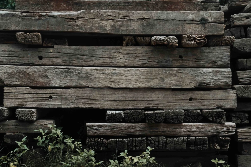 Close-up of reclaimed teak wood from Nusantara Lifestyle with visible grain and weathered character