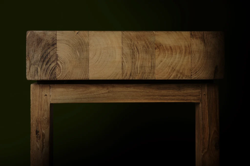 Richly textured reclaimed teak wood showing natural grain and aged tones.