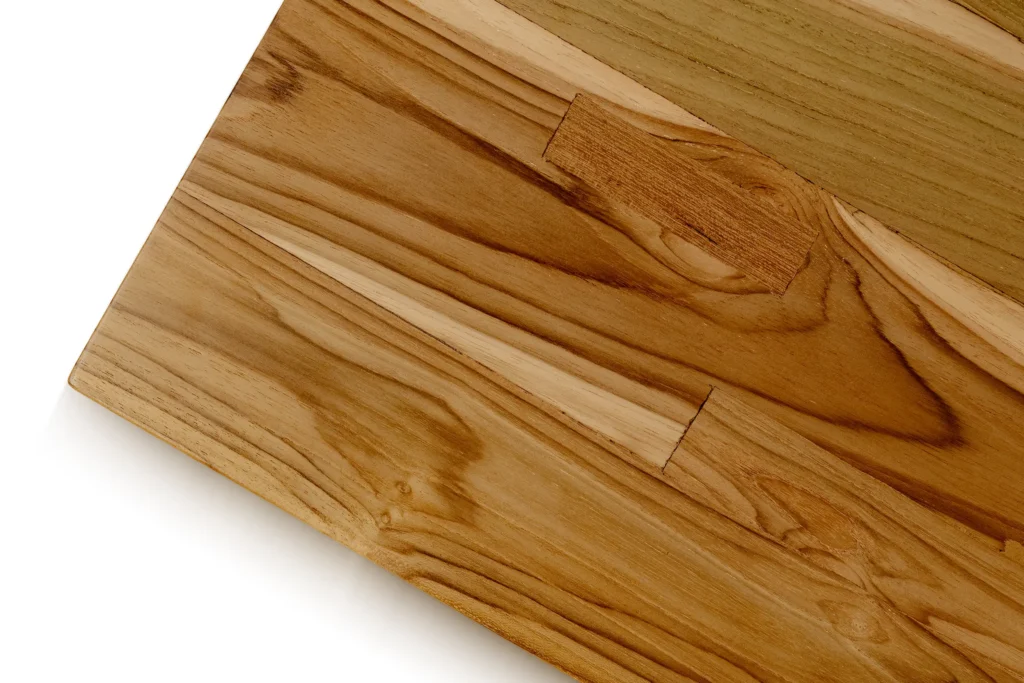 Close-up of reclaimed teak wood from Nusantara Lifestyle with visible grain and weathered character