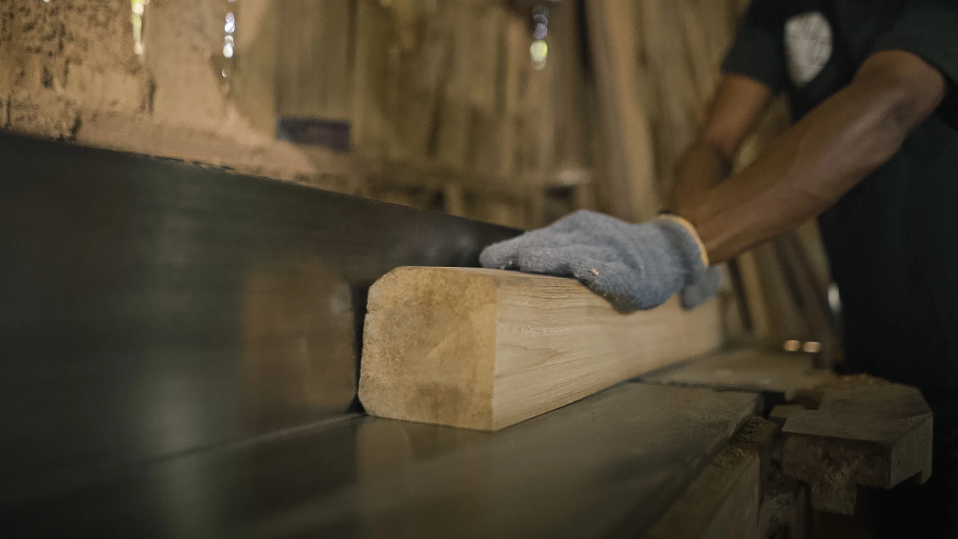 Reclaimed teak timber being prepared by hand in Nusantara Lifestyle’s workshop, showing the care and craftsmanship behind long-lasting furniture
