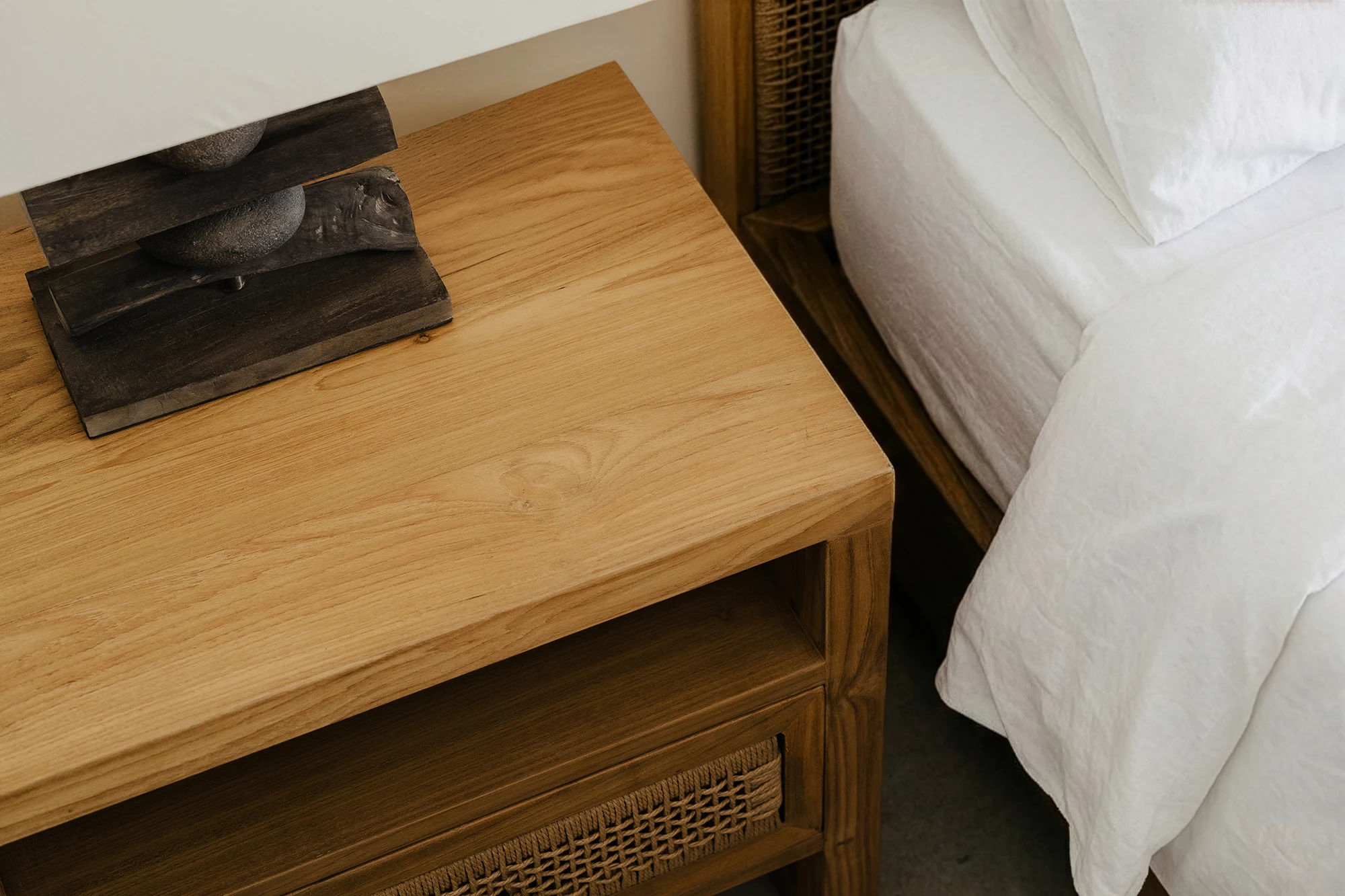 Close-up of reclaimed teak timber furniture from Nusantara Lifestyle with refined grain and smooth modern finish
