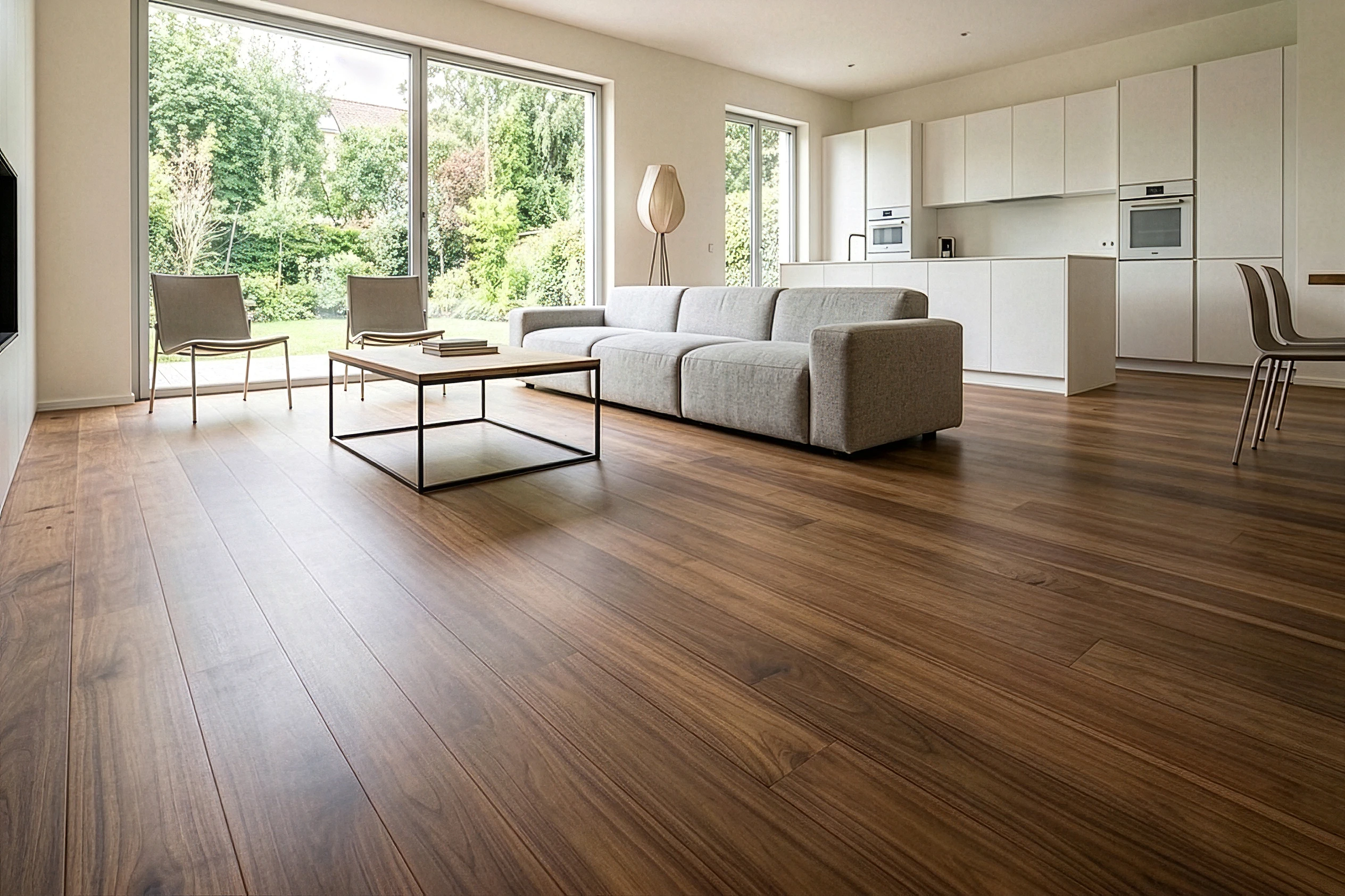 Solid reclaimed teak flooring installed over underfloor heating in a modern European home, showcasing the stability and warmth of timber reclaimed and restored by Nusantara Lifestyle.