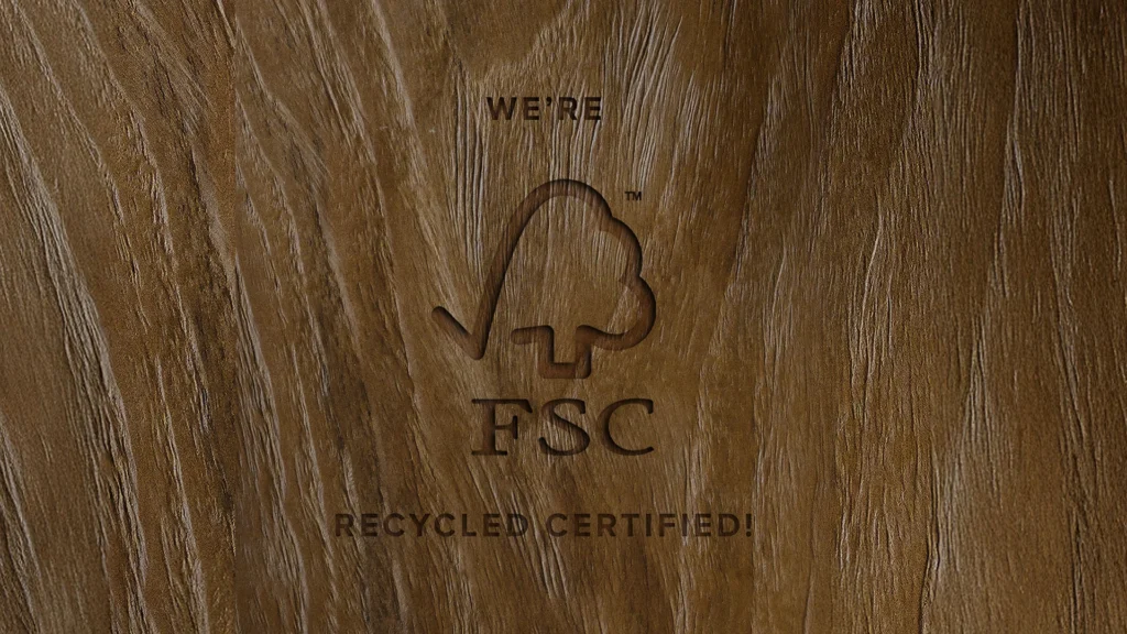 A wooden slab carved with the words We’re FSC Recycled Certified! which is the Forest Stewardship Council certification held by Nusantata Lifestyle.