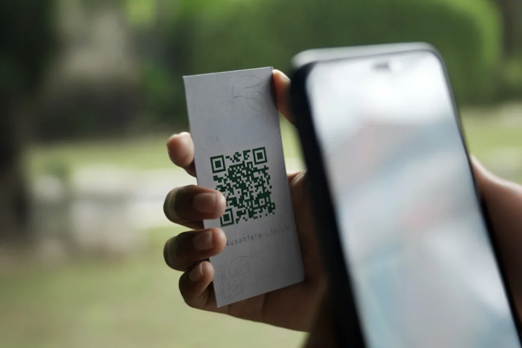 Scanning Nusantara Lifestyle Origin QR code for reclaimed teak story