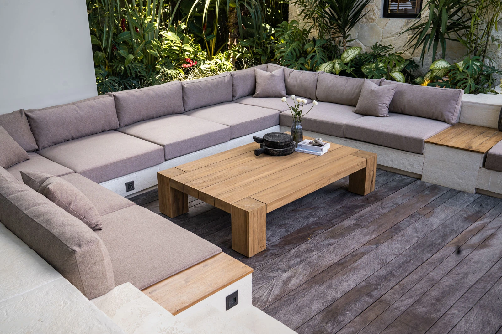 A wide view of a custom reclaimed teak coffee table highlights its natural depth of grain and texture.