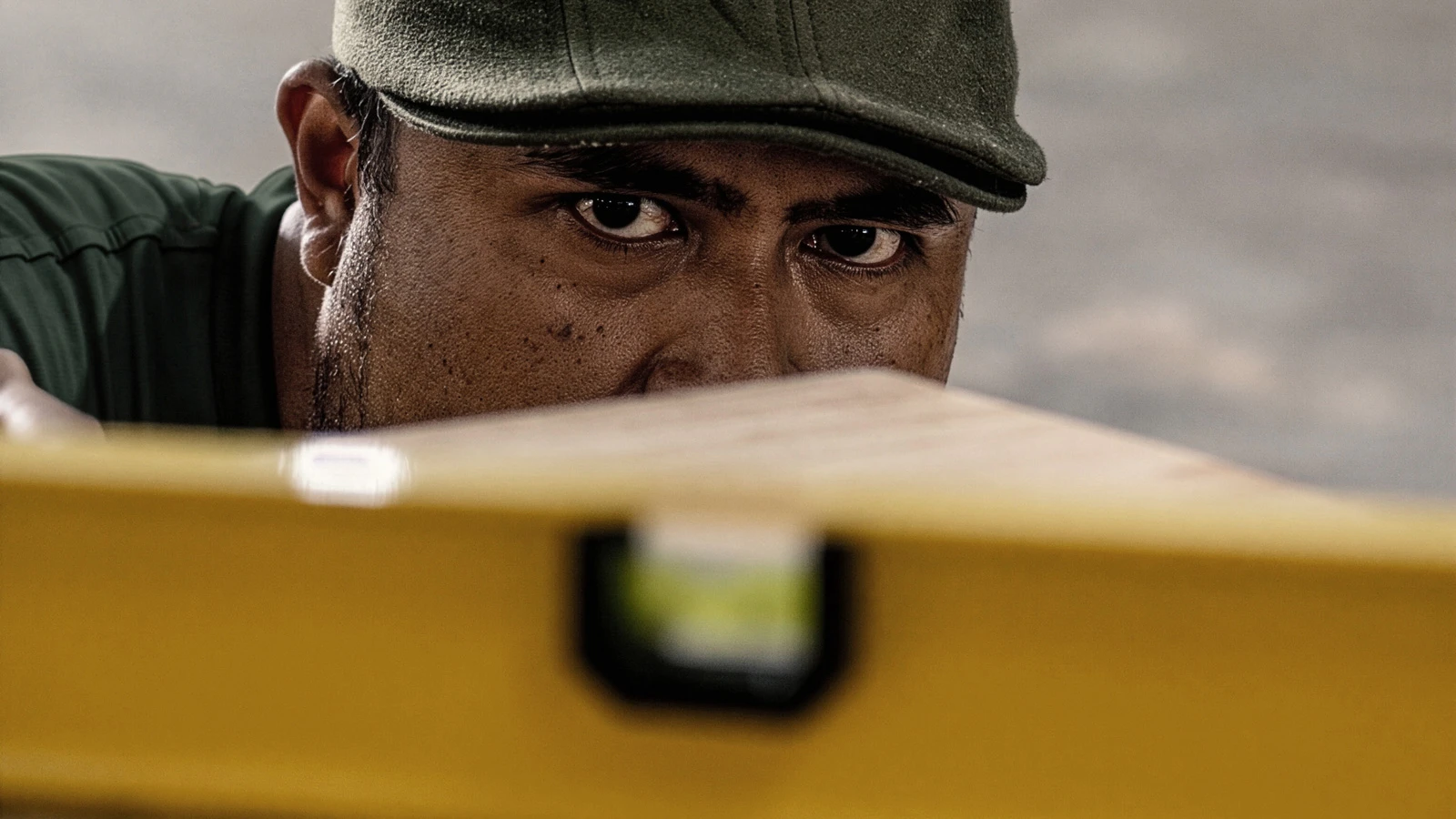 Nusantara Lifestyle staff uses a spirit level during the quality control process to ensure the surface quality and structural stability of the furniture.