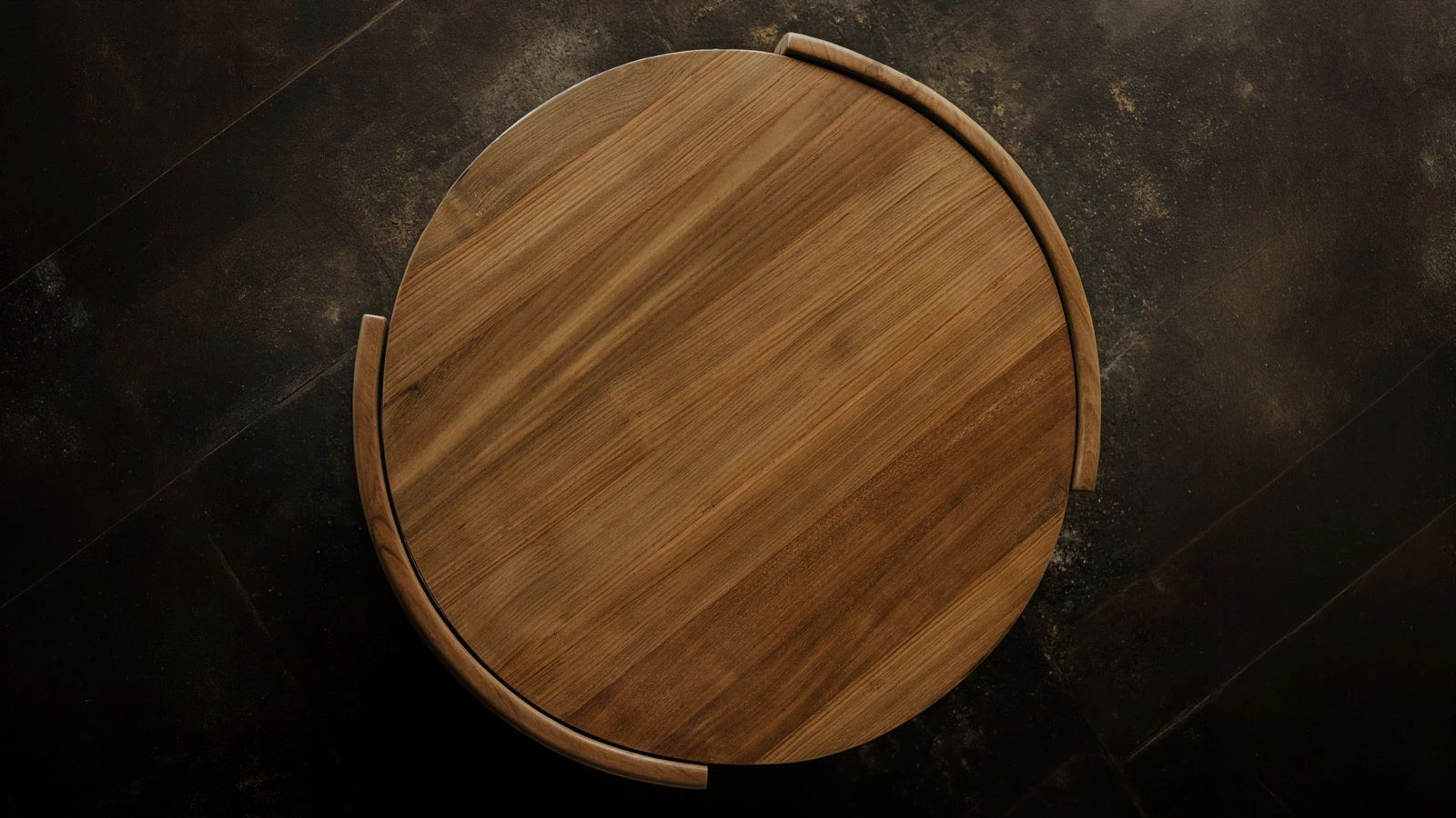 A top-down view of a round custom table showcases the unique natural markings and rich tones of the reclaimed timber.