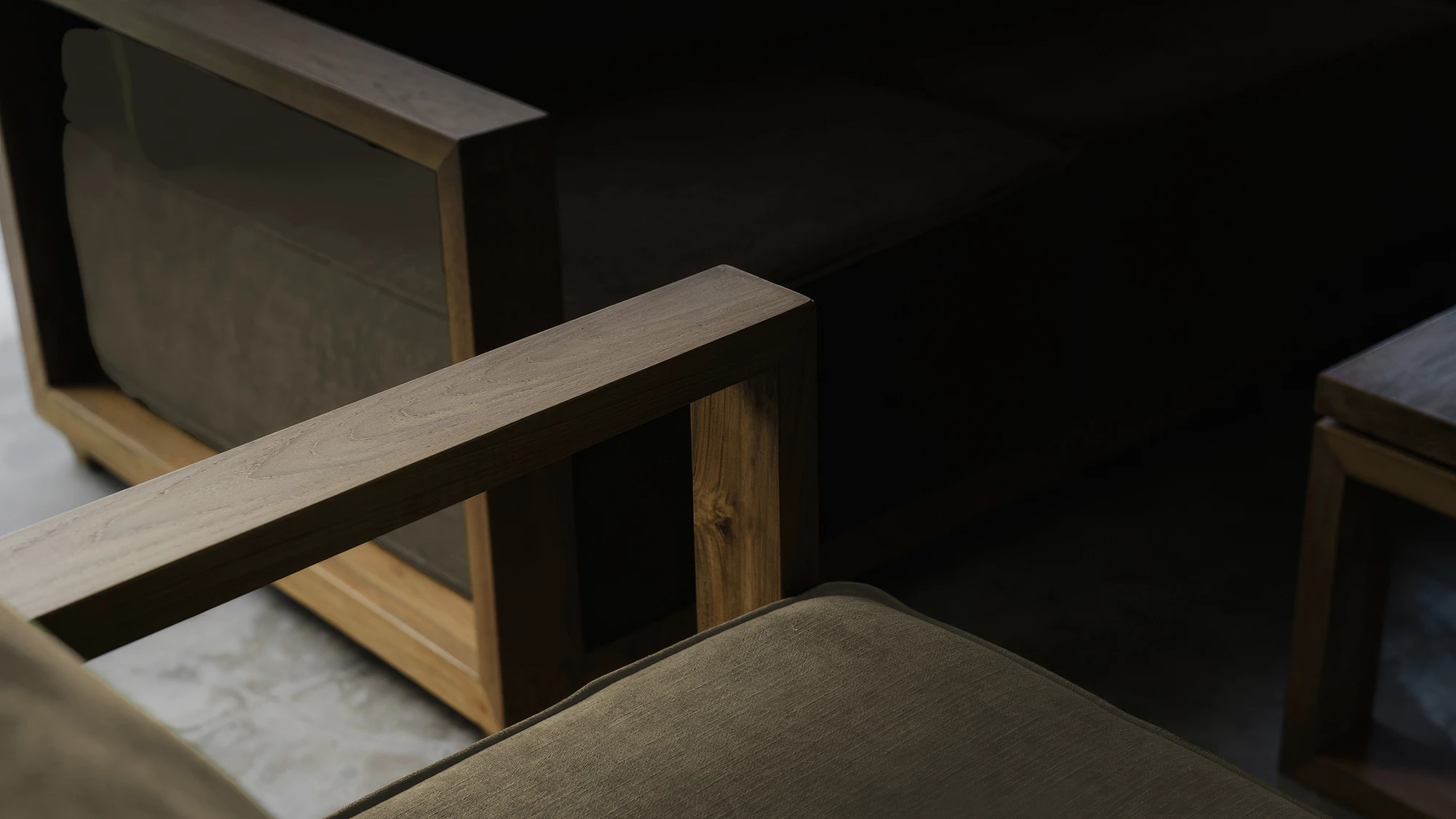 Close-up view of reclaimed teak furniture showcasing natural grain patterns, aged texture, and handcrafted details.