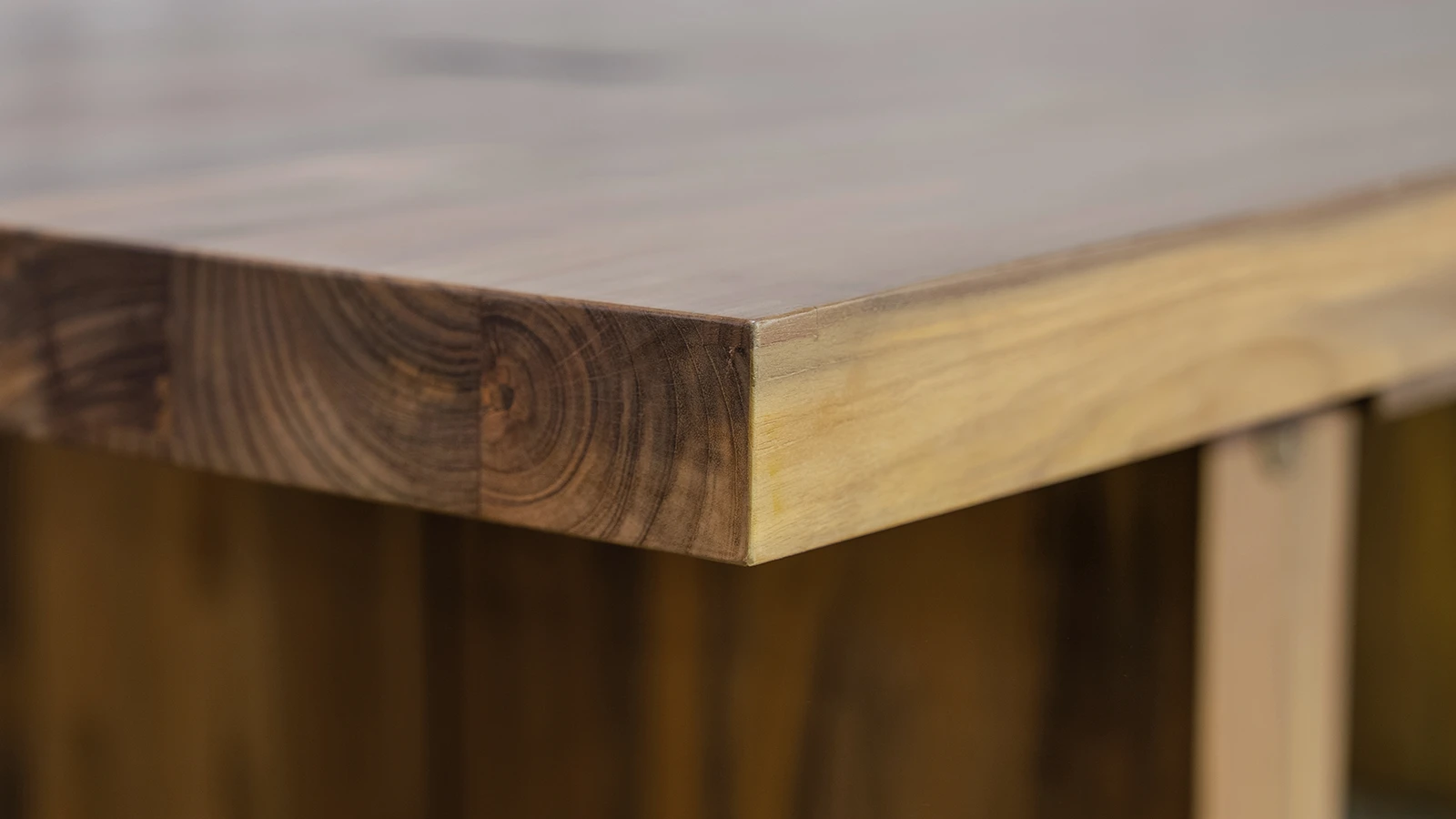 Close-up of the texture and natural grain of eco-friendly reclaimed teak wood with distinctive signs of age.