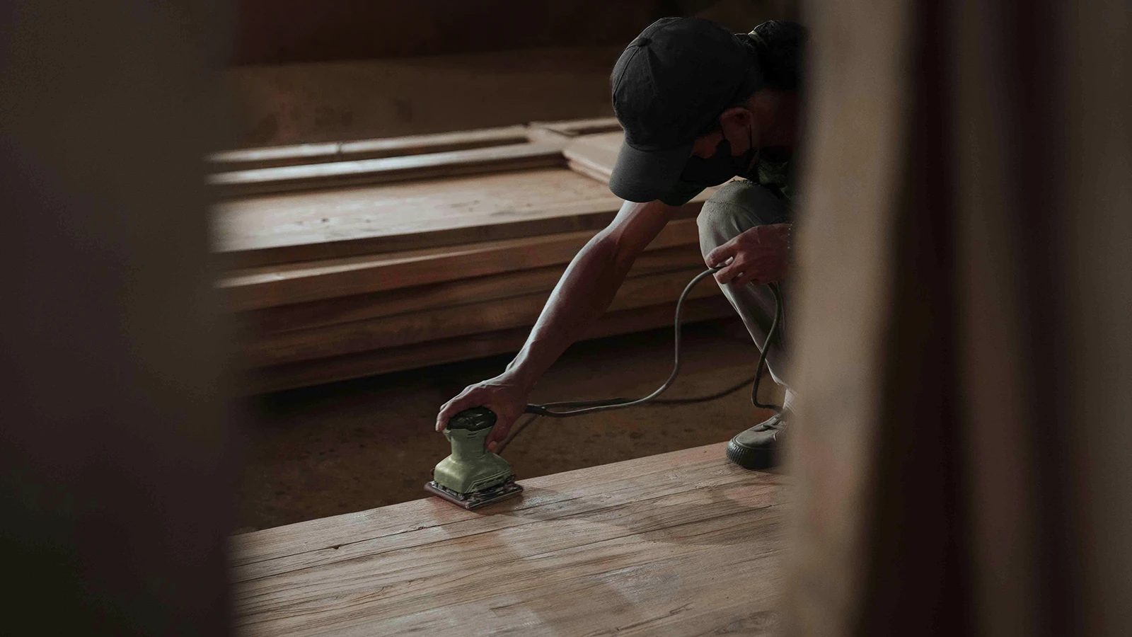 Indonesian artisans crafting reclaimed teak for Nusantara Lifestyle.